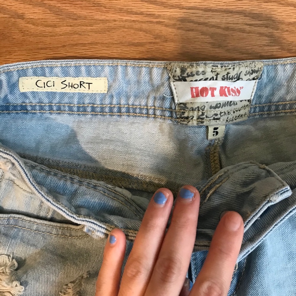 Light and dark jean distressed midi short.